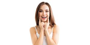 Woman pointing to smile