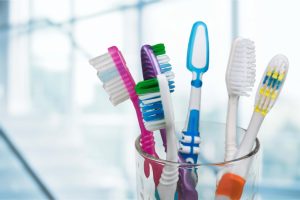 assortment of toothbrushes different colors